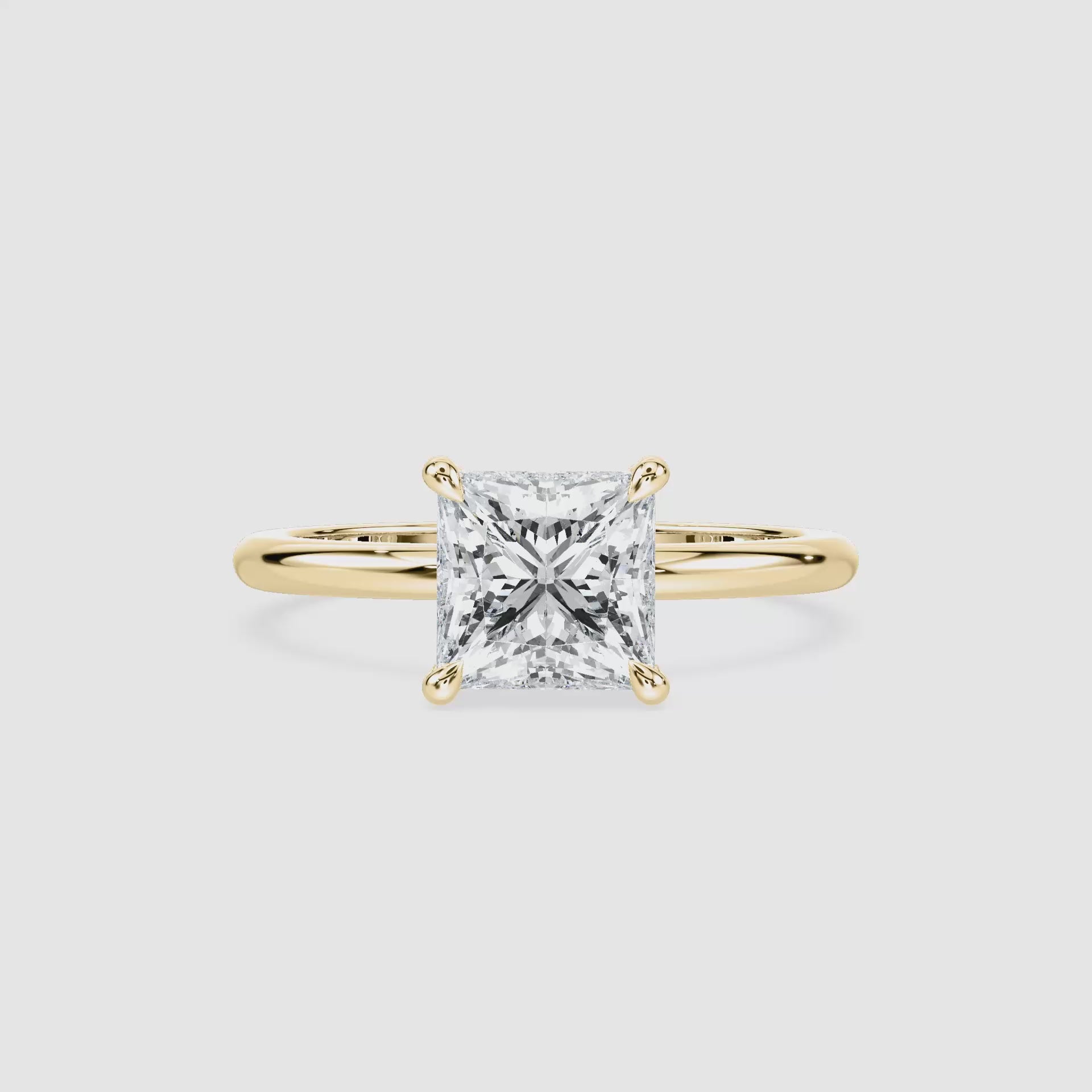 Video laden: Clara Solitaire Verlobungsring – Prinzessschliff – Gelbgold – Video