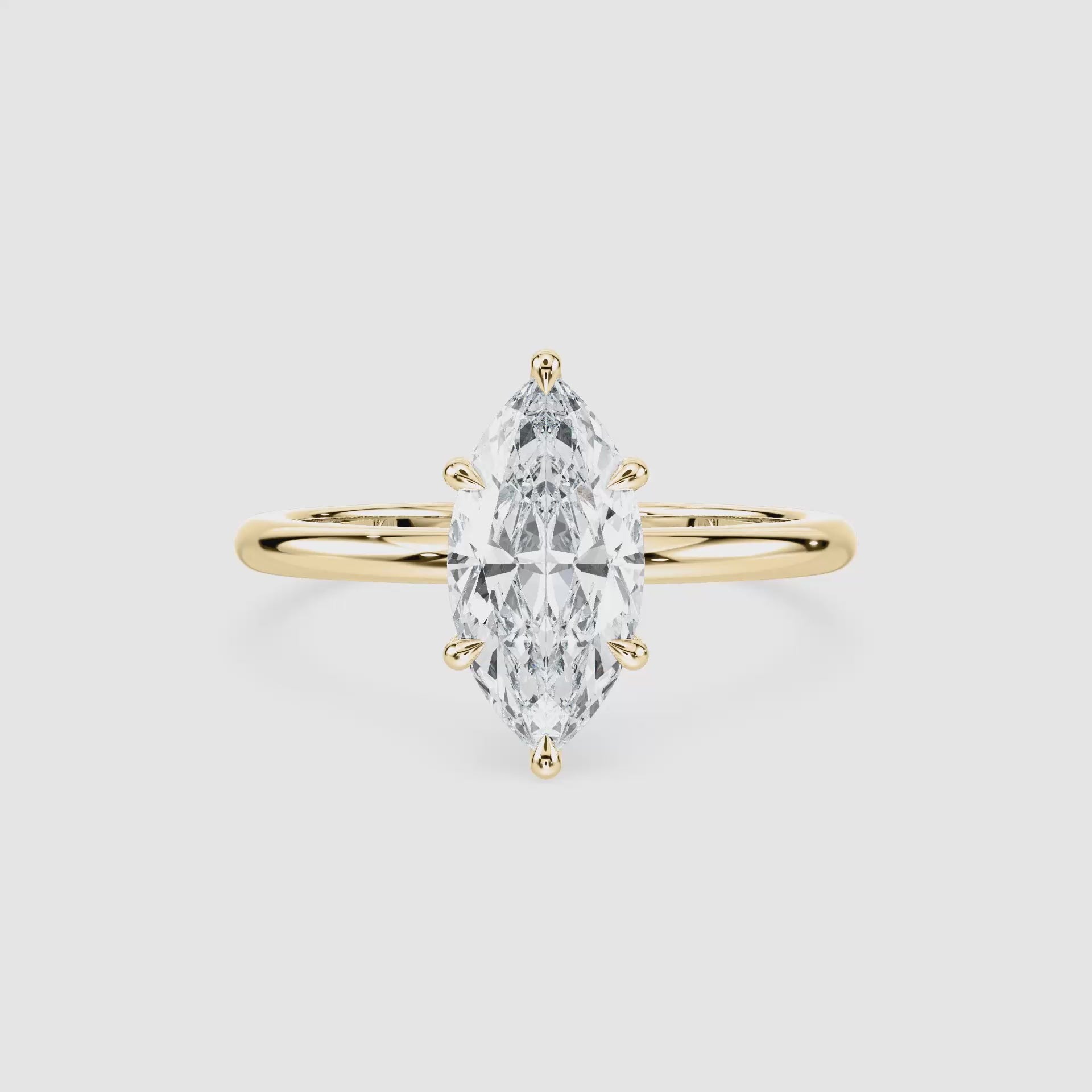 Video laden: Clara Solitaire Verlobungsring – Marquiseschliff – Gelbgold – Video