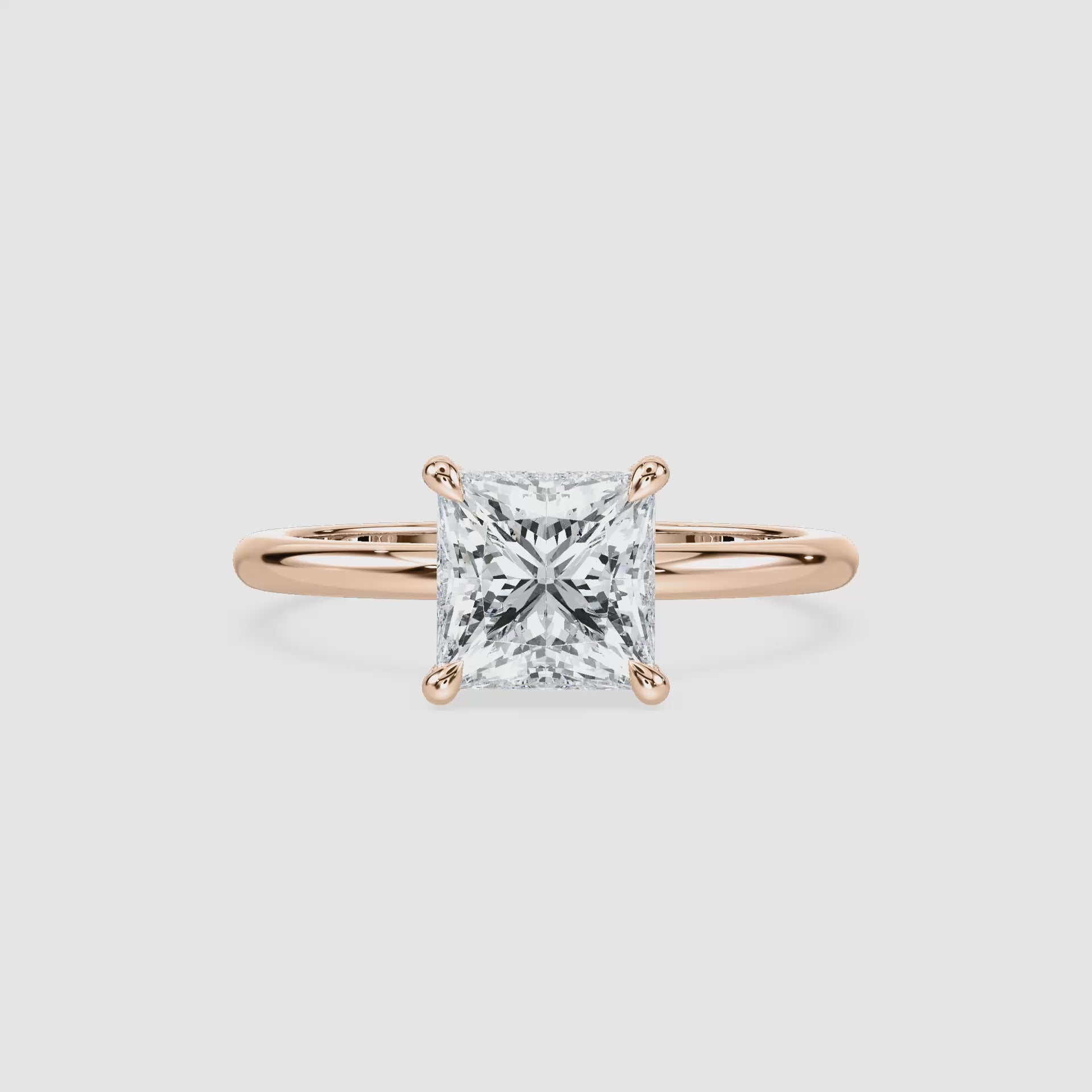 Video laden: Clara Solitaire Verlobungsring – Prinzessschliff – Roségold – Video