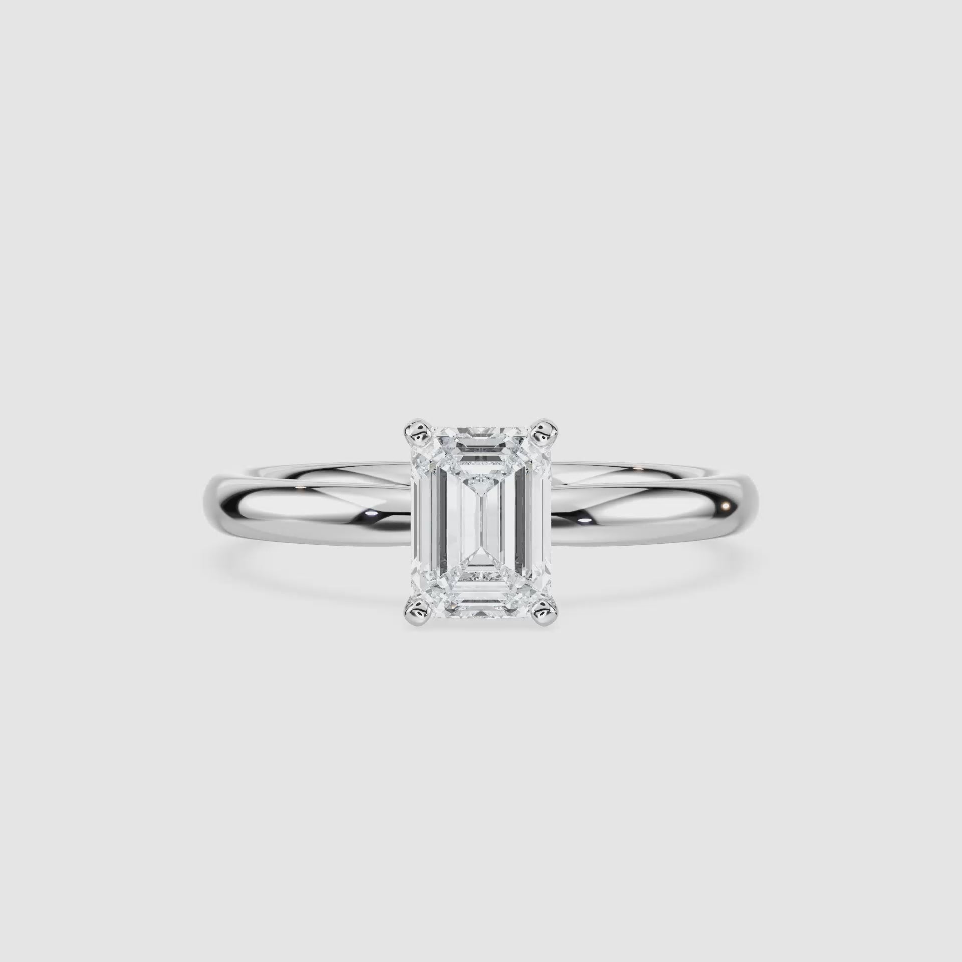 Video laden: Emilia Solitaire Verlobungsring – Smaragdschliff – Weißgold – Video