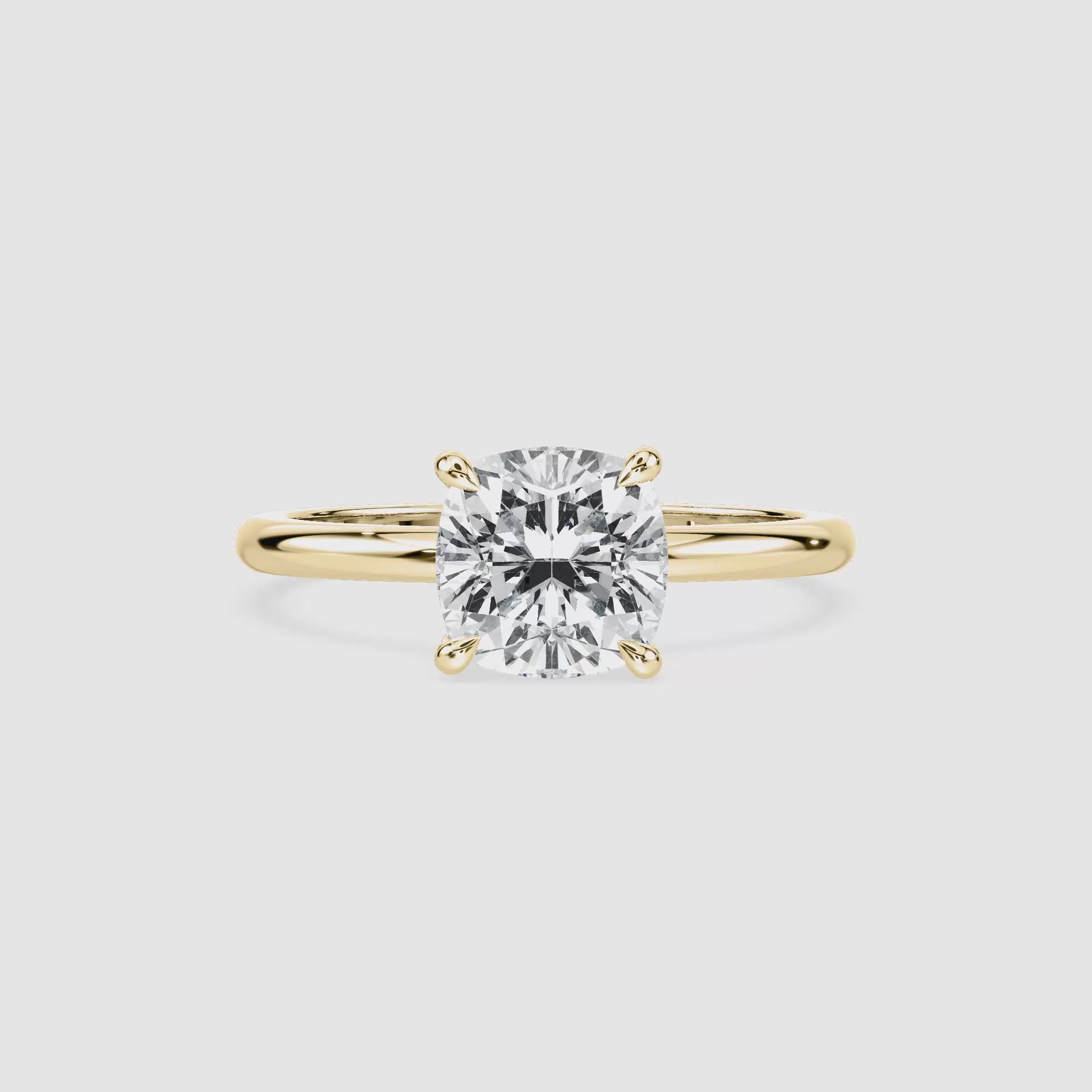 Video laden: Clara Solitaire Verlobungsring – Kissenschliff – Gelbgold – Video