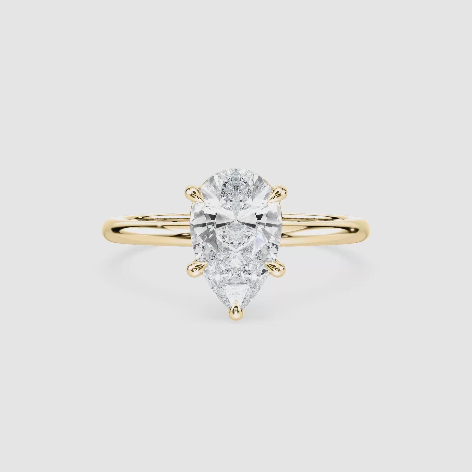 Video laden: Clara Solitaire Verlobungsring – Tropfenschliff – Gelbgold – Video